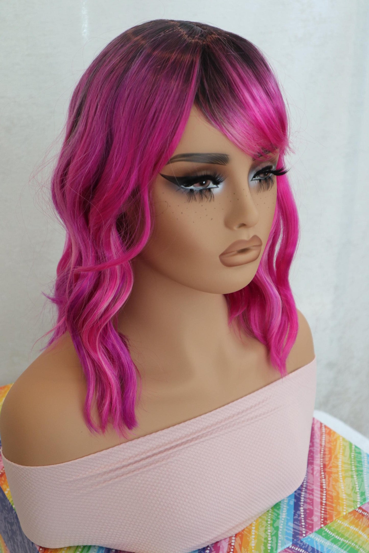 Shoulder Length Wavy Fuchsia Wig with Lavender & Pink Hues, Dark Brown Ombre Roots, Vibrant Synthetic Hair for Cosplay and Fashion