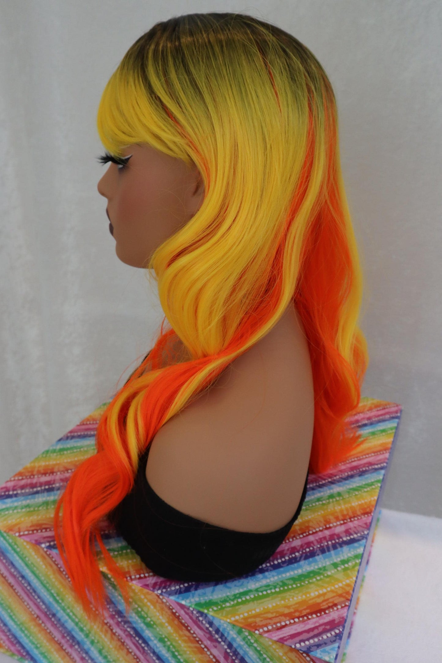 Candy Corn Wavy Wig with Orange, Yellow & Dark Roots + Bangs