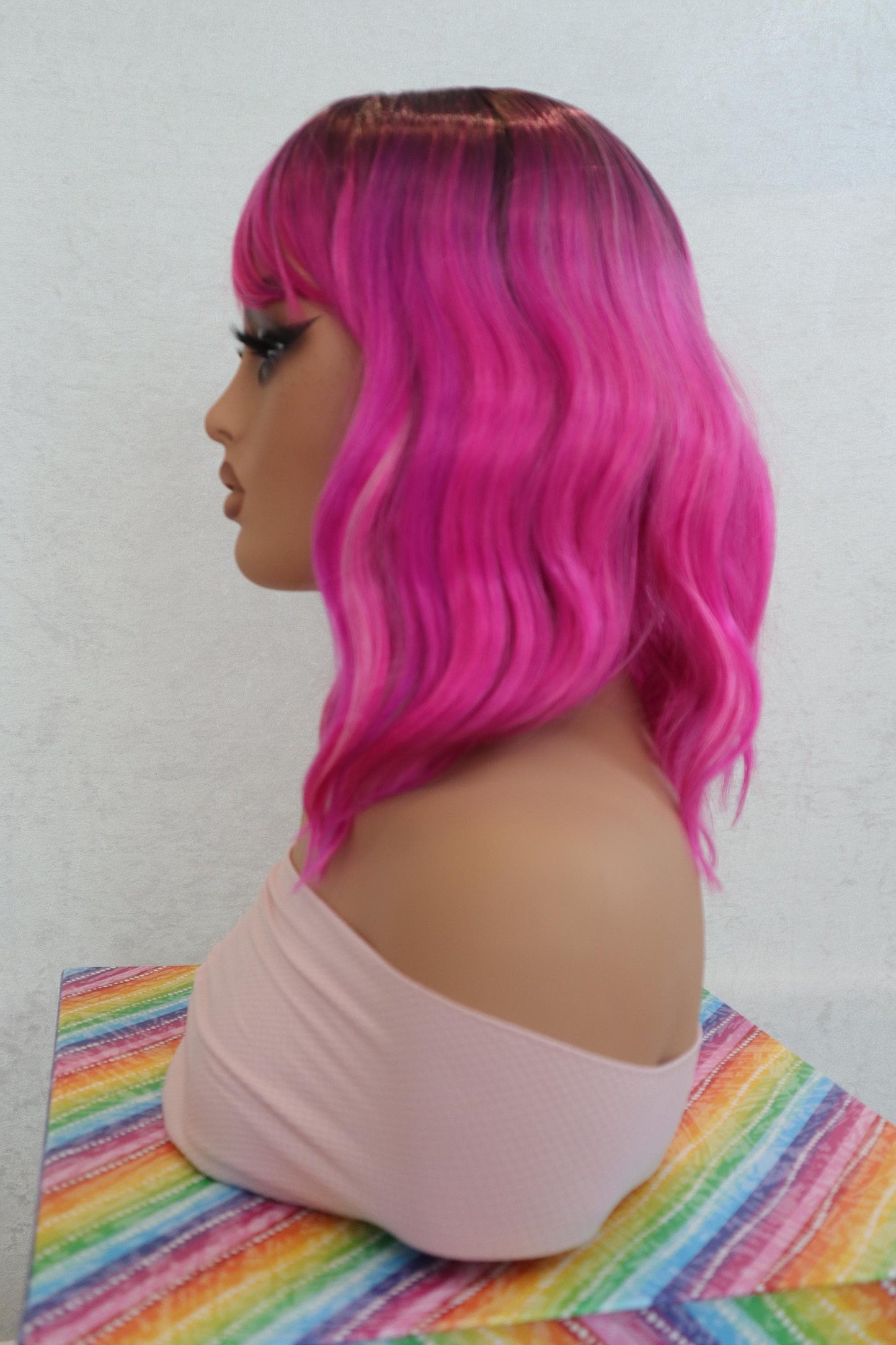 Shoulder Length Wavy Fuchsia Wig with Lavender & Pink Hues, Dark Brown Ombre Roots, Vibrant Synthetic Hair for Cosplay and Fashion