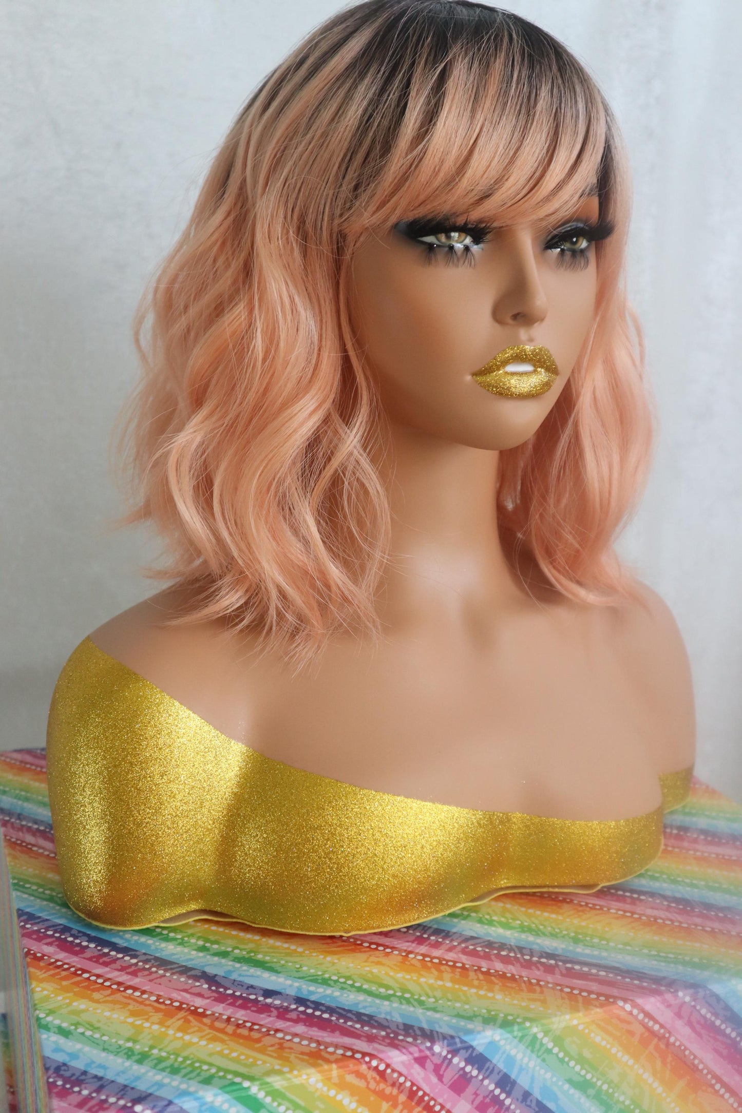 Peach Bliss 12" Wavy Wig with Dark Roots and Bangs - Fun & Vibrant for Cosplay and Everyday Glam