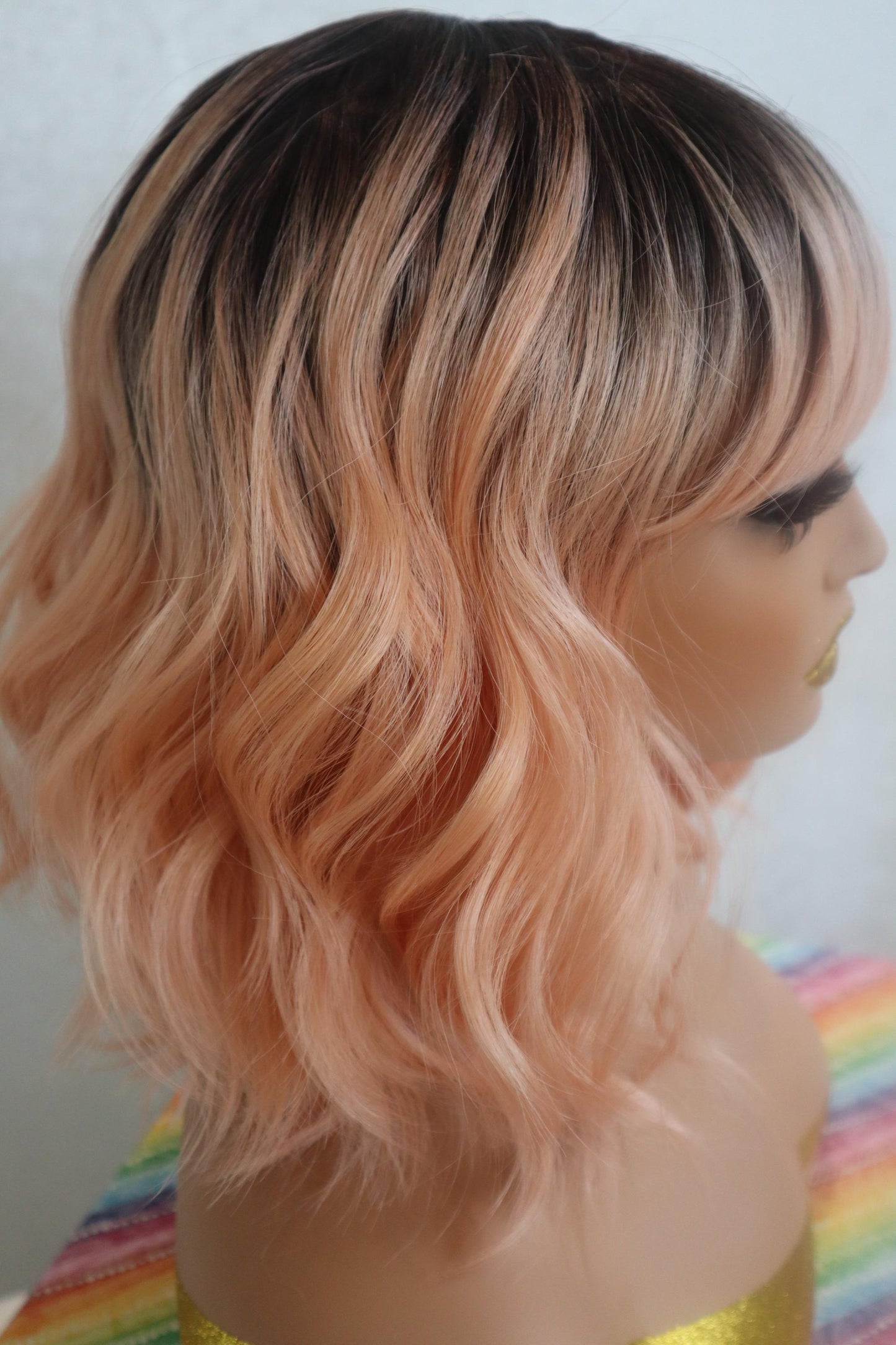 Peach Bliss 12" Wavy Wig with Dark Roots and Bangs - Fun & Vibrant for Cosplay and Everyday Glam