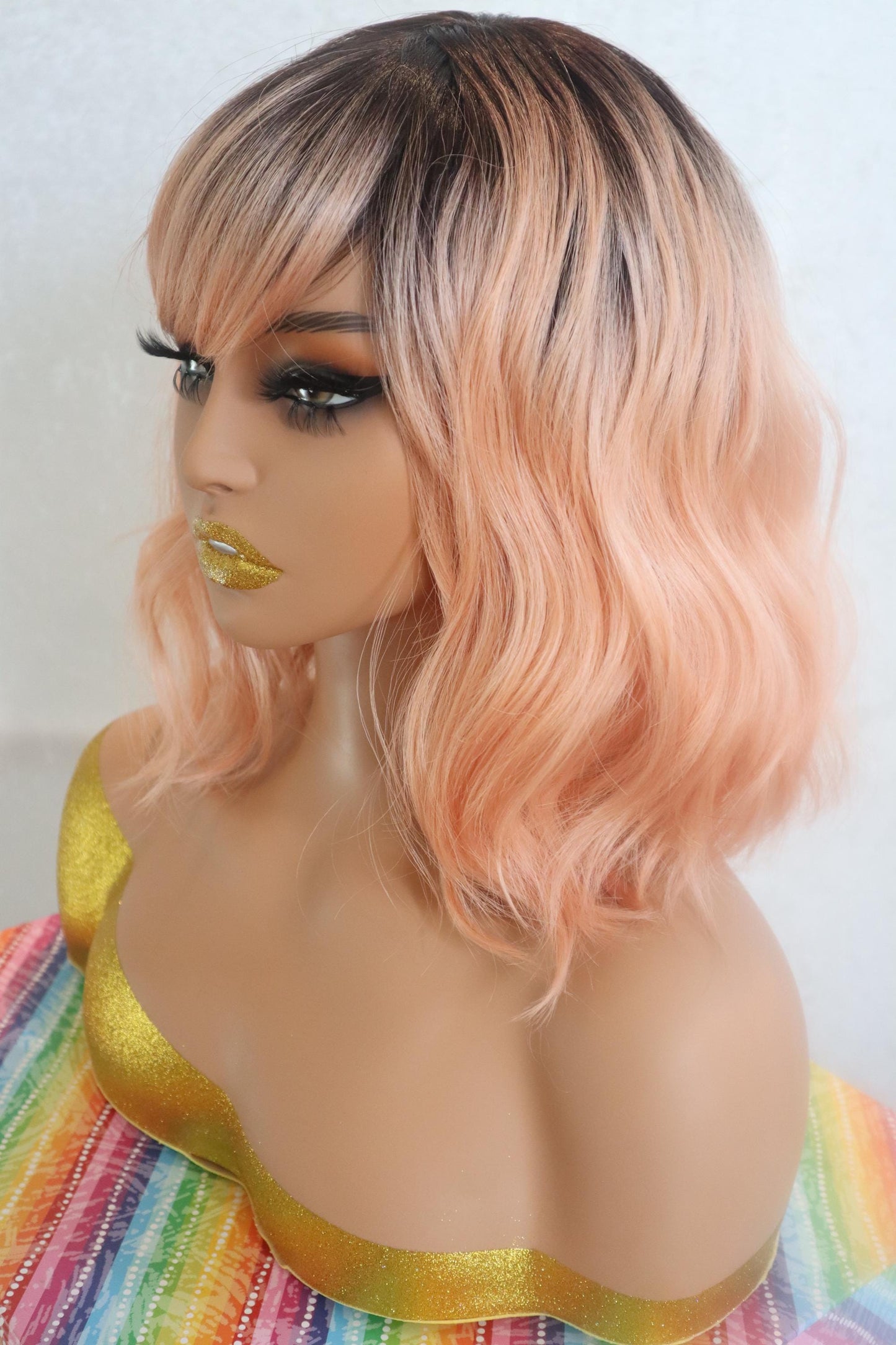 Peach Bliss 12" Wavy Wig with Dark Roots and Bangs - Fun & Vibrant for Cosplay and Everyday Glam