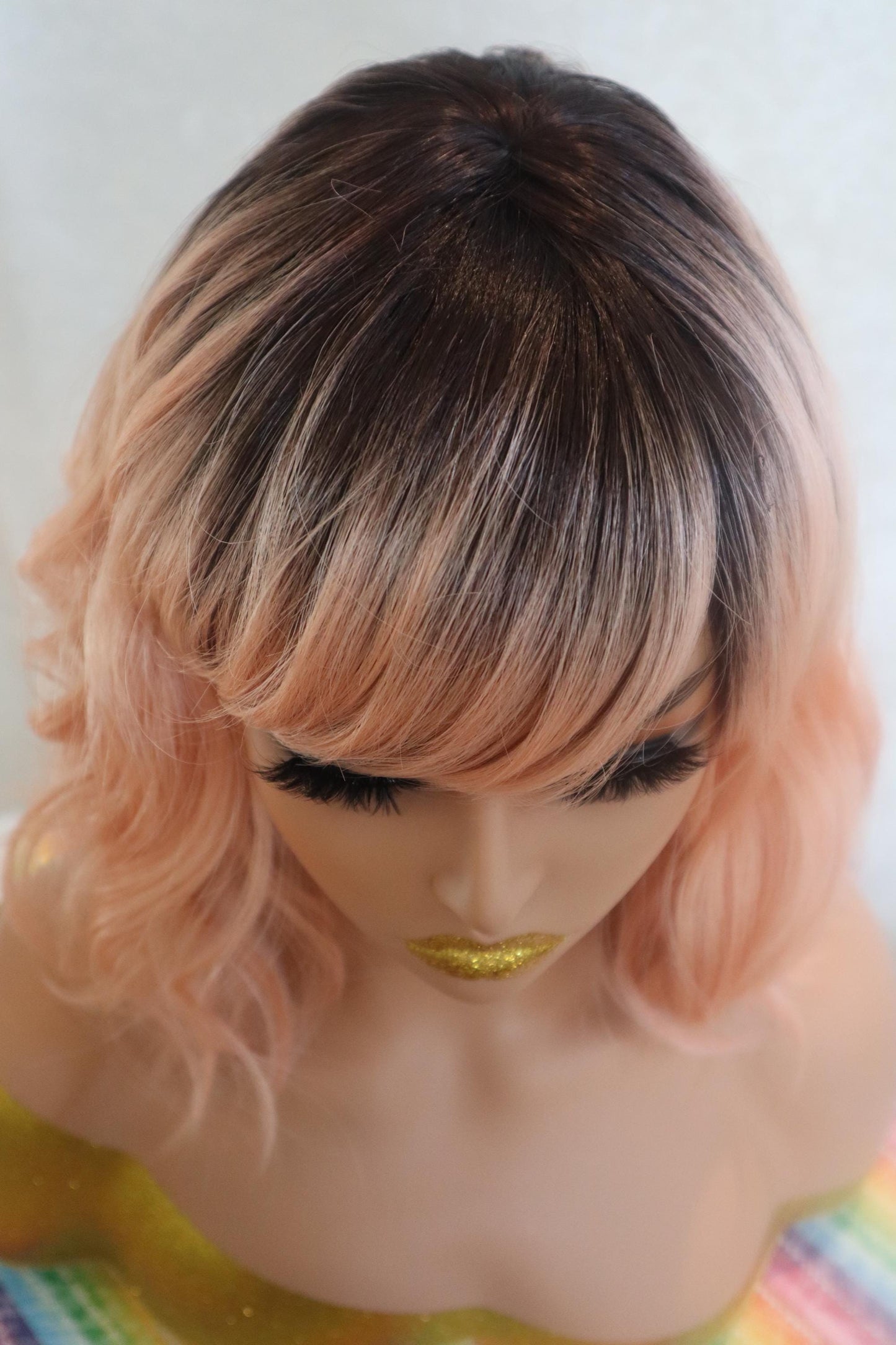 Peach Bliss 12" Wavy Wig with Dark Roots and Bangs - Fun & Vibrant for Cosplay and Everyday Glam